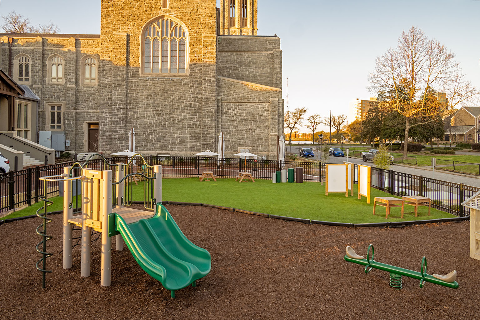 Church playground with wooden play pieces