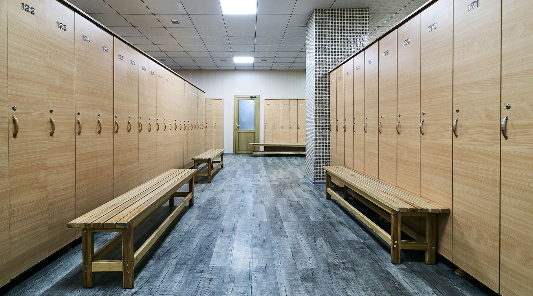 Locker room with wooden doors and benches